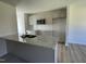 Modern kitchen with granite countertops and stainless steel appliances at 83 Harvest Hills Ln, Dunn, NC 28334