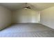 Living room with high ceiling and ceiling fan at 83 Harvest Hills Ln, Dunn, NC 28334