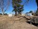 Large backyard with two sheds and mature trees at 1002 Godwin Ln, Dunn, NC 28334