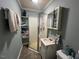 Bathroom with shower, vanity, and ample storage at 1002 Godwin Ln, Dunn, NC 28334