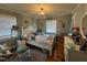 Bright bedroom with a white bed frame and wood floors at 1002 Godwin Ln, Dunn, NC 28334