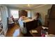 Comfortable bedroom with hardwood floors and large windows at 1002 Godwin Ln, Dunn, NC 28334