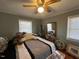 Bedroom with a large bed and ceiling fan at 1002 Godwin Ln, Dunn, NC 28334