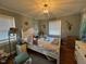 Bright bedroom with a white bed frame and wood floors at 1002 Godwin Ln, Dunn, NC 28334