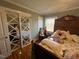 Bedroom with mirrored closet doors and hardwood floors at 1002 Godwin Ln, Dunn, NC 28334