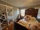 Bedroom with mirrored closet doors and hardwood floors at 1002 Godwin Ln, Dunn, NC 28334