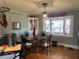 Bright dining area with a glass-top table and bay window at 1002 Godwin Ln, Dunn, NC 28334