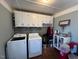 Laundry room with washer, dryer, and cabinets at 1002 Godwin Ln, Dunn, NC 28334
