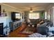 Spacious living room with hardwood floors and sectional sofa at 1002 Godwin Ln, Dunn, NC 28334