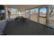 Screened porch with table and chairs, perfect for relaxing at 1002 Godwin Ln, Dunn, NC 28334