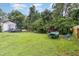 Large backyard with trampoline, shed and plenty of green space at 1006 W Broad St, Dunn, NC 28334