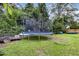 Large backyard with trampoline and green space at 1006 W Broad St, Dunn, NC 28334