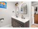 Modern bathroom with a double vanity and arched mirrors at 1006 W Broad St, Dunn, NC 28334