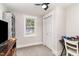 Well-lit bedroom with a window, closet, and home office area at 1006 W Broad St, Dunn, NC 28334