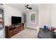 Bright bedroom featuring a TV, built-in shelving, and a workspace at 1006 W Broad St, Dunn, NC 28334
