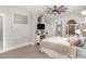 Bright bedroom with a ceiling fan, large windows and built-in shelving at 1006 W Broad St, Dunn, NC 28334