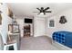 Spacious bedroom with a ceiling fan, TV, and ample closet space at 1006 W Broad St, Dunn, NC 28334