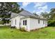 White sided home with a metal roof and large backyard at 1006 W Broad St, Dunn, NC 28334