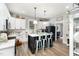 Bright kitchen features white cabinets, subway tile backsplash, stainless steel appliances and kitchen island with breakfast bar at 1006 W Broad St, Dunn, NC 28334