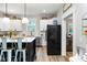 Modern kitchen with white cabinets, quartz countertops, and a large island at 1006 W Broad St, Dunn, NC 28334