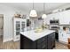 Spacious kitchen with white cabinets, an island, and stainless steel appliances at 1006 W Broad St, Dunn, NC 28334