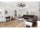 Spacious living room with a brown sectional sofa and wood floors at 1006 W Broad St, Dunn, NC 28334