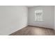 Simple bedroom with wood-look floors and a window at 1112 Middlecrest Dr, Rocky Mount, NC 27804