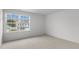 Bright bedroom with large window and neutral carpeting at 1112 Middlecrest Dr, Rocky Mount, NC 27804