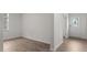 Hallway with wood-look floors and a view of a front door at 1112 Middlecrest Dr, Rocky Mount, NC 27804