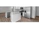 Kitchen features island, stainless steel appliances, and hardwood floors at 1112 Middlecrest Dr, Rocky Mount, NC 27804