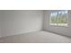 Spacious bedroom with large window and neutral carpeting at 1141 Middlecrest Dr, Rocky Mount, NC 27804
