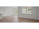View of a bright dining area with large windows and hardwood floors at 1141 Middlecrest Dr, Rocky Mount, NC 27804