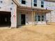 New home under construction features a covered porch and multiple windows for lots of natural light at 116 Black Walnut Dr # 203, Garner, NC 27529