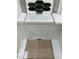 Close-up of interior selections like dark green backsplash tiles, a white countertop, and light wood flooring at 116 Black Walnut Dr # 203, Garner, NC 27529