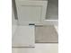 Selection of white cabinet door with Silestone countertop and a floor tile sample at 116 Black Walnut Dr # 203, Garner, NC 27529