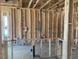 Unfinished Kitchen featuring exposed framing, natural light, and plumbing at 116 Black Walnut Dr # 203, Garner, NC 27529