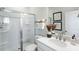 A bathroom features a glass shower, sink, mirror, and decorative items at 1224 Hardin Hill Ln, Knightdale, NC 27545