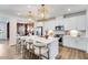 A kitchen island features a sink, bar stool seating and stainless appliances at 1224 Hardin Hill Ln, Knightdale, NC 27545