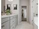 Well-appointed bathroom featuring double vanity and a glass-enclosed shower at 1228 Hardin Hill Ln, Knightdale, NC 27545