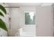 Bright bathroom with glass shower and soaking tub at 1228 Hardin Hill Ln, Knightdale, NC 27545