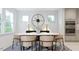Elegant dining room with an oval table, six chairs, and modern decor at 1228 Hardin Hill Ln, Knightdale, NC 27545