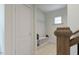 This entryway is next to the stairs and has a bench with cubbies and hooks to hang up coats at 1228 Hardin Hill Ln, Knightdale, NC 27545