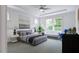 Spacious main bedroom with ample natural light and stylish decor at 1228 Hardin Hill Ln, Knightdale, NC 27545