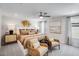 Serene main bedroom suite with cozy seating, a king size bed, decorative art, and ample natural light at 1252 Hardin Hill Ln, Knightdale, NC 27545