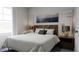 Bedroom with wood headboard and window at 1279 Willow Tree Way, Graham, NC 27253