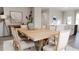 Light-filled dining area features a wood table with seating for six at 1279 Willow Tree Way, Graham, NC 27253