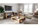 Relaxing living room with light-colored sofas and a large TV at 1279 Willow Tree Way, Graham, NC 27253