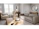 Spacious living room with comfortable seating and large windows at 1279 Willow Tree Way, Graham, NC 27253