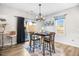 Bright dining room features a table with four chairs and access to a back patio at 142 Jade St, Smithfield, NC 27577