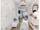Spacious foyer with white built-ins, a view into the living room, and wood-look floors at 142 Jade St, Smithfield, NC 27577